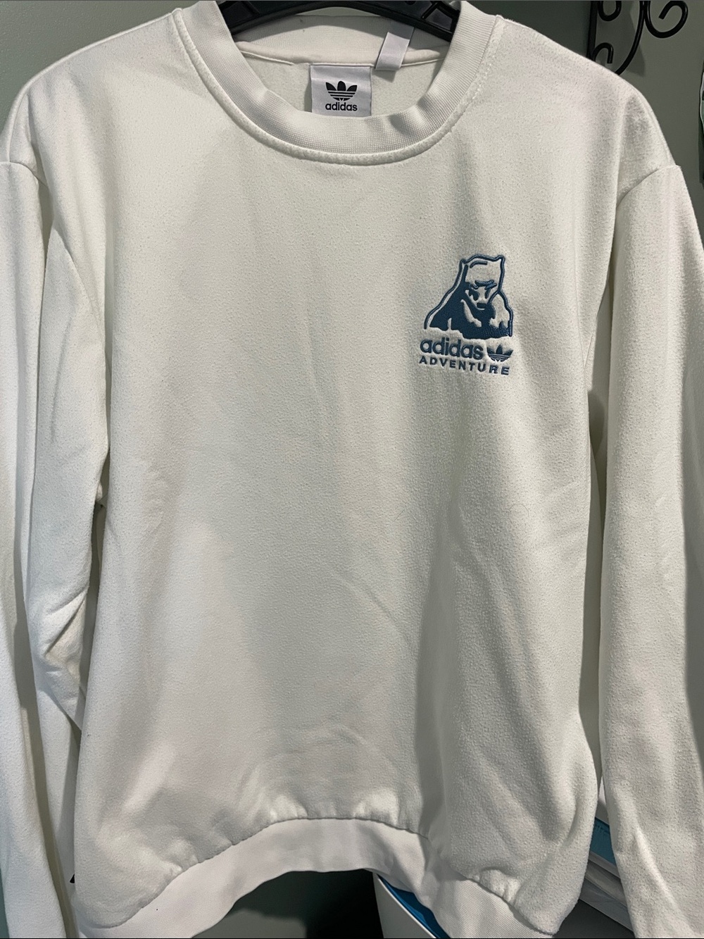 adidas White Crewneck Sweatshirt with Blue Adventure Logo